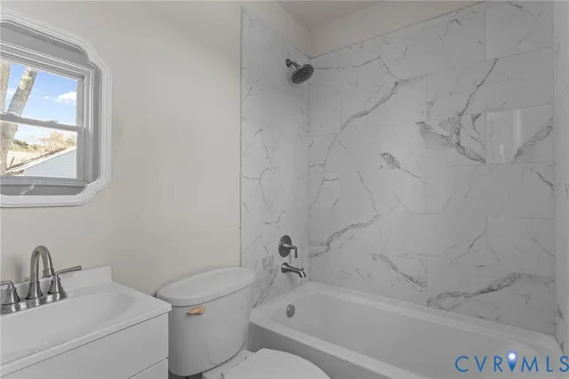 a bathroom with a sink toilet and bathtub