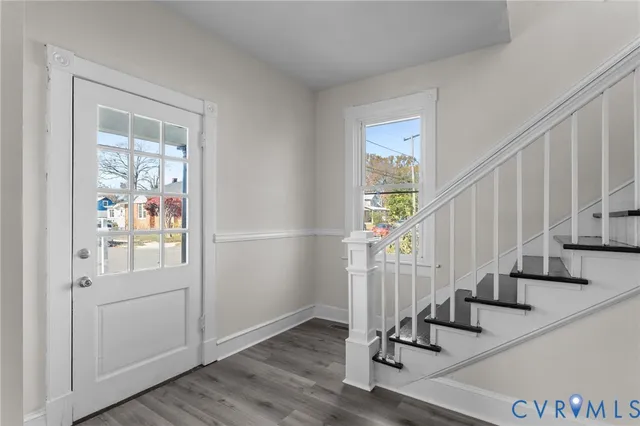 a view of entryway with wooden floor