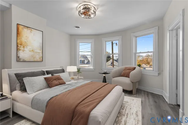 a bedroom with bed and window