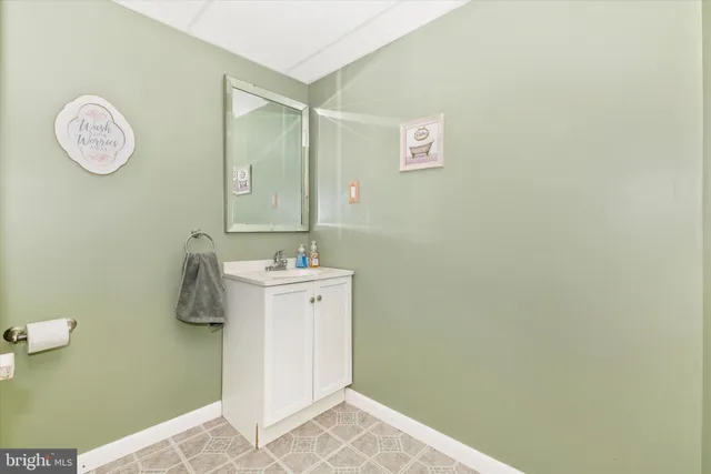 a bathroom with a shower and sink