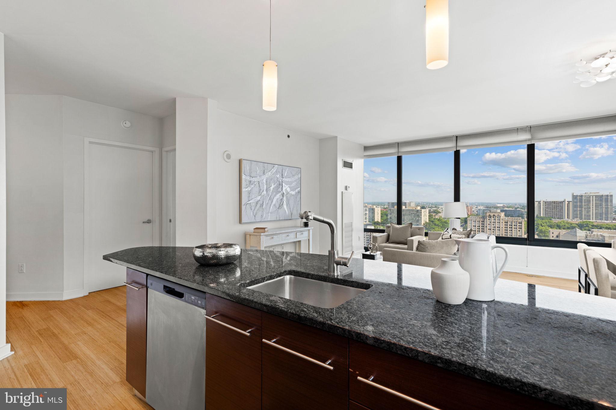 2101 Market Street, Unit 2007 Philadelphia, PA 19103 - Photo 13 of 45 a kitchen with a sink and a large window