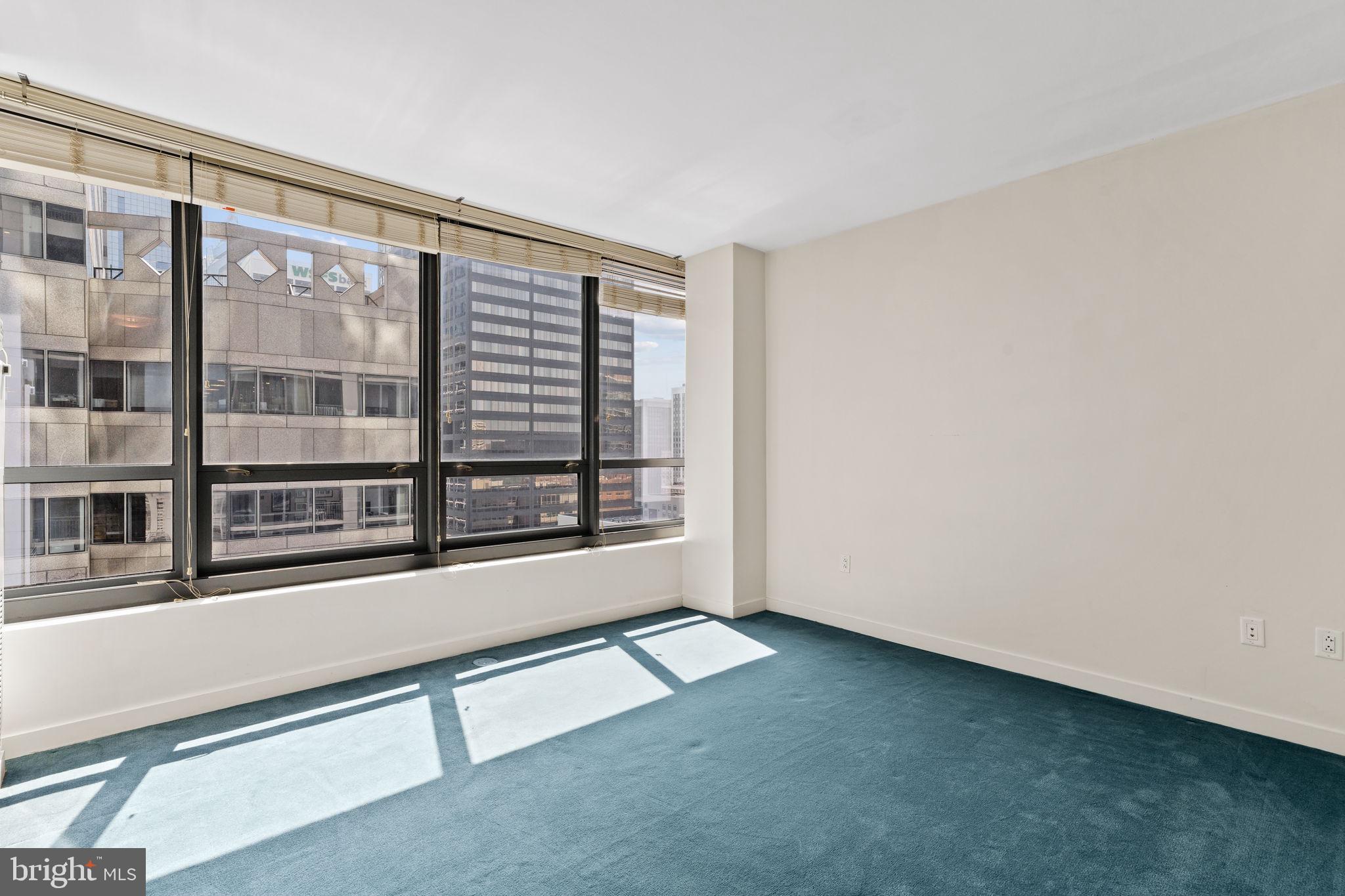 2101 Market Street, Unit 2007 Philadelphia, PA 19103 - Photo 24 of 45 a view of an empty room with a window