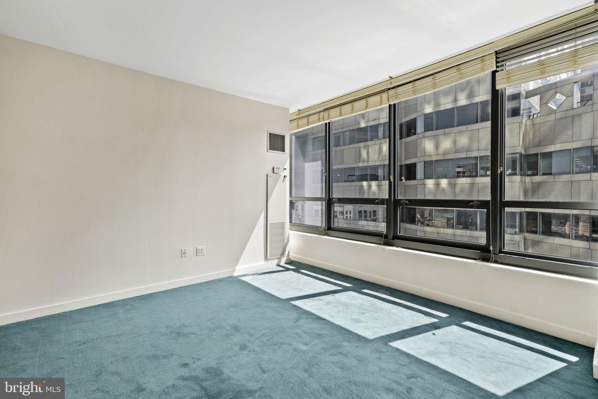 2101 Market Street, Unit 2007 Philadelphia, PA 19103 - Photo 25 of 45 a view of an empty room with a window