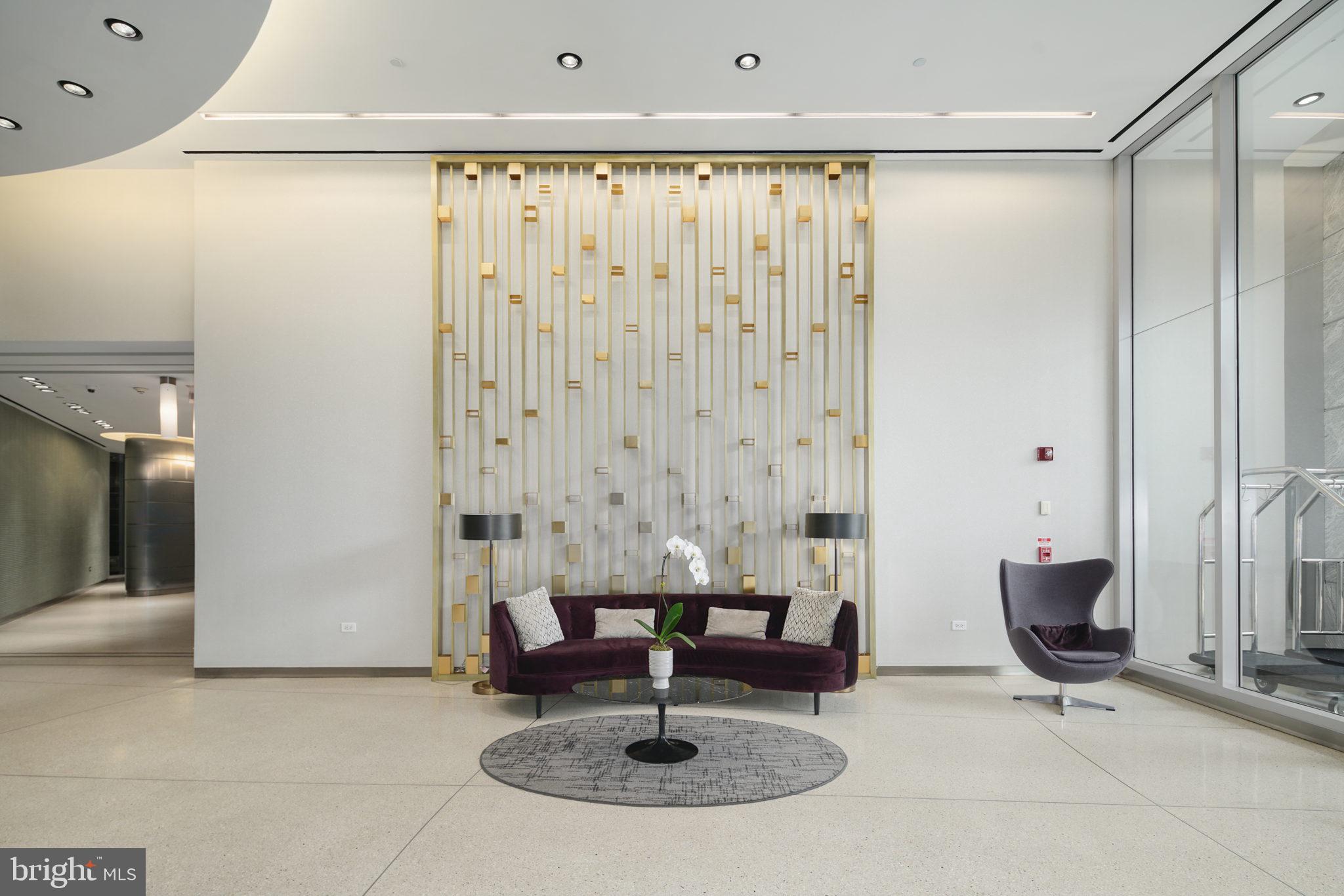 2101 Market Street, Unit 2007 Philadelphia, PA 19103 - Photo 33 of 45 a view of a livingroom with couch and painted walls