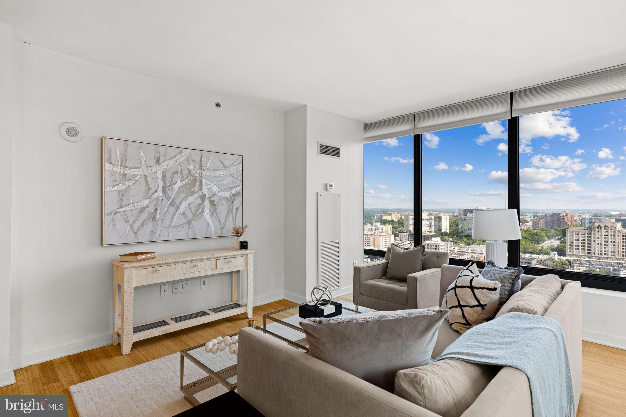2101 Market Street, Unit 2007 Philadelphia, PA 19103 - Photo 9 of 45 a living room with furniture large window and outer view
