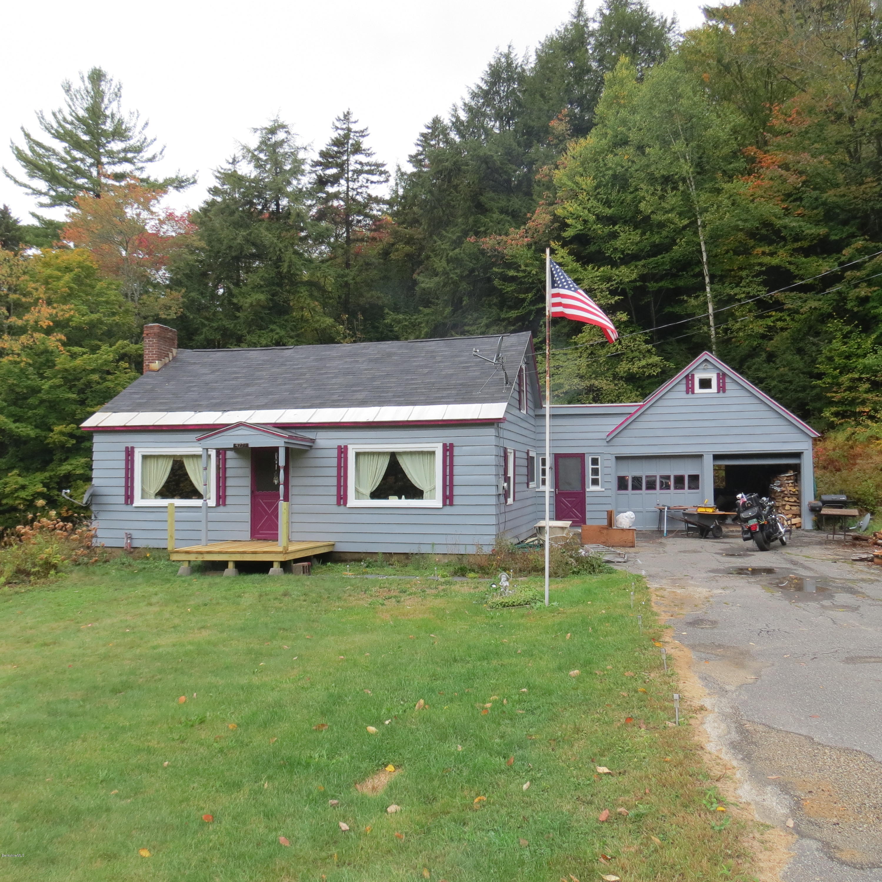 4733 Main Road Stamford, VT 05352 - Photo 1 of 39 a house that has sitting area in front of it