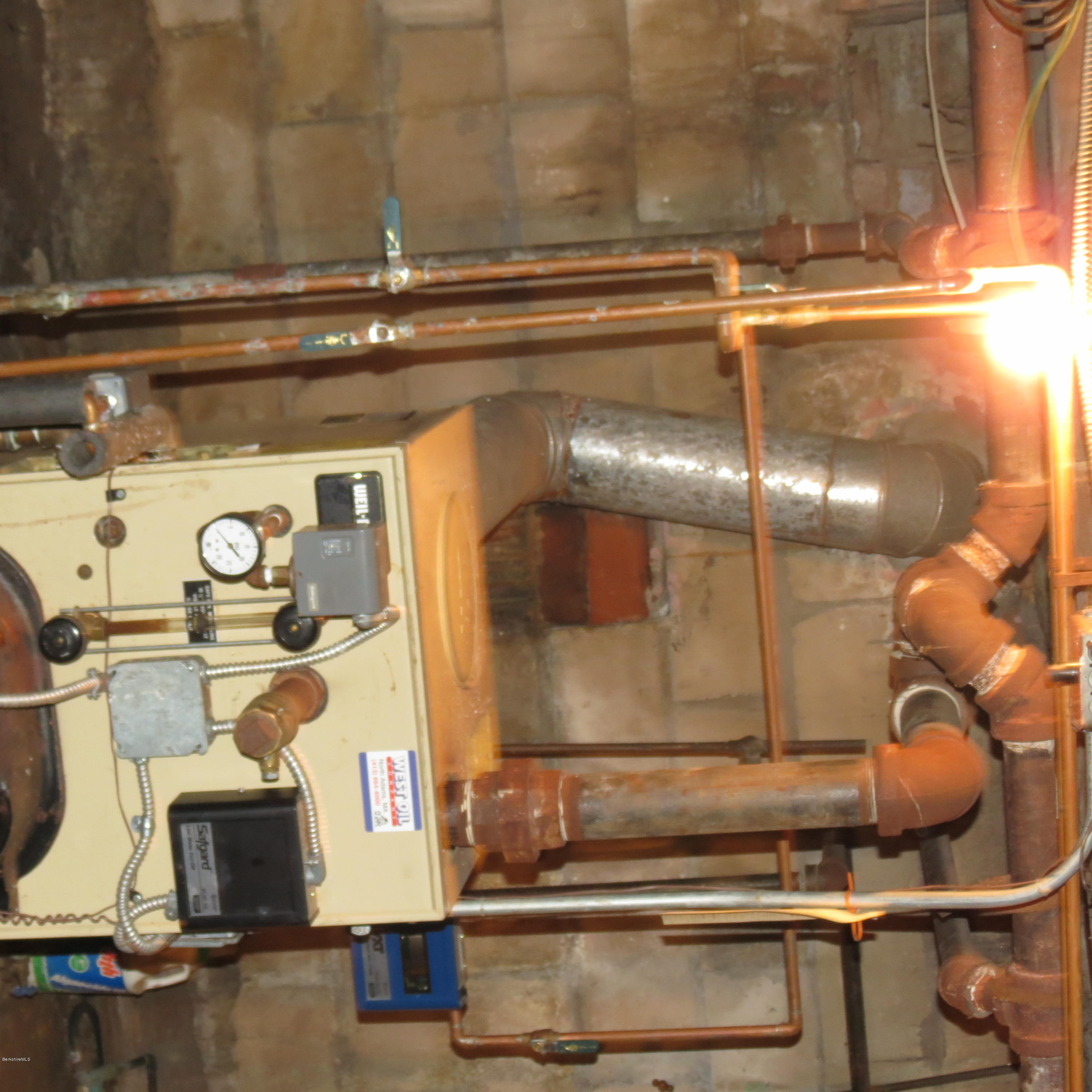 4733 Main Road Stamford, VT 05352 - Photo 17 of 39 a bathroom with a sink and mirror