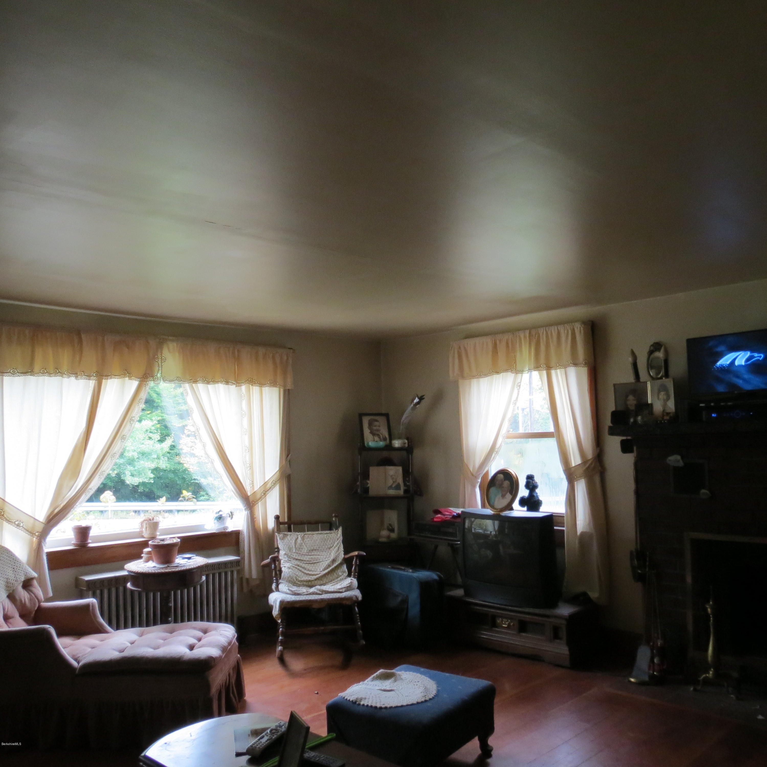 4733 Main Road Stamford, VT 05352 - Photo 4 of 39 a living room with furniture and a large window