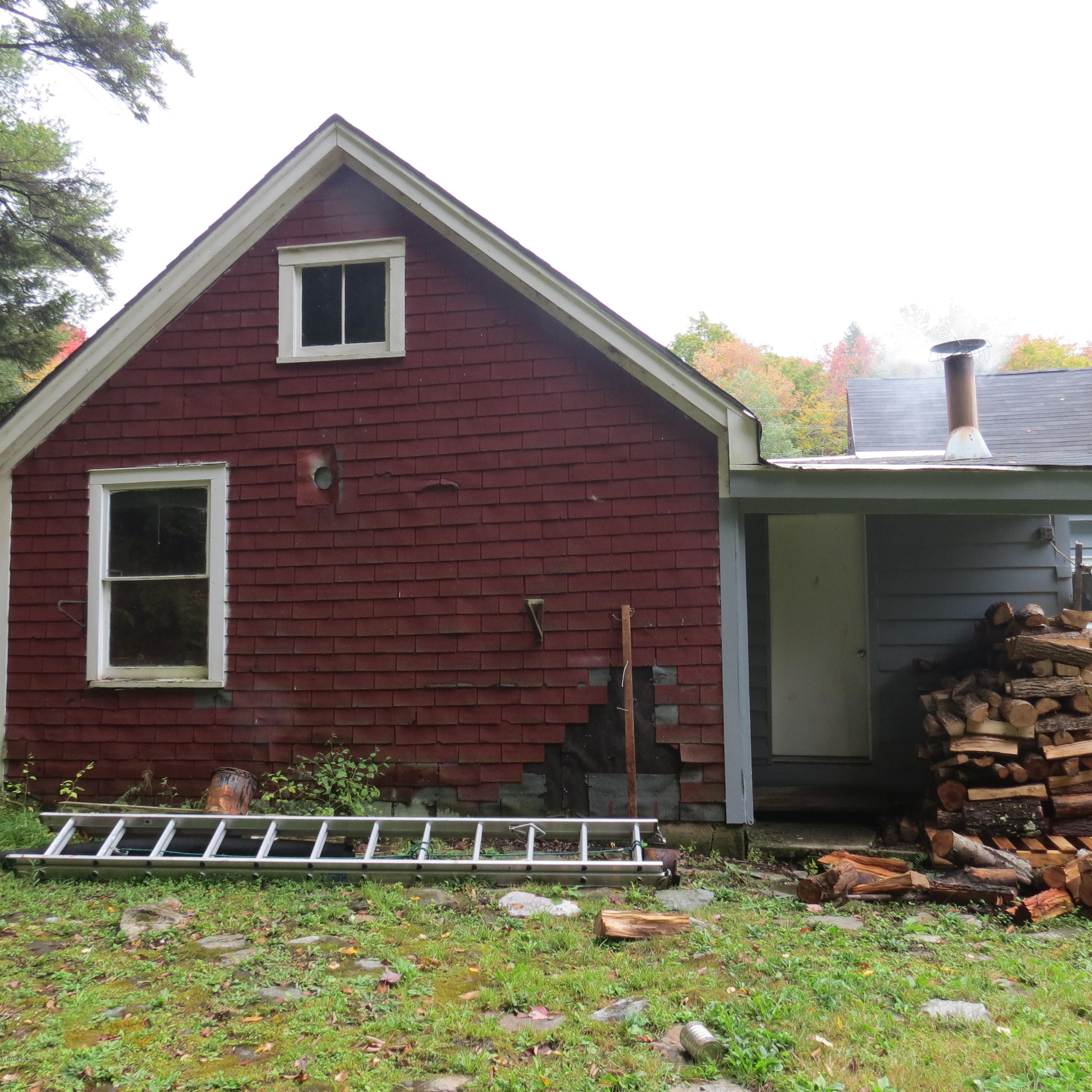 4733 Main Road Stamford, VT 05352 - Photo 33 of 39 a front view of a house with a yard