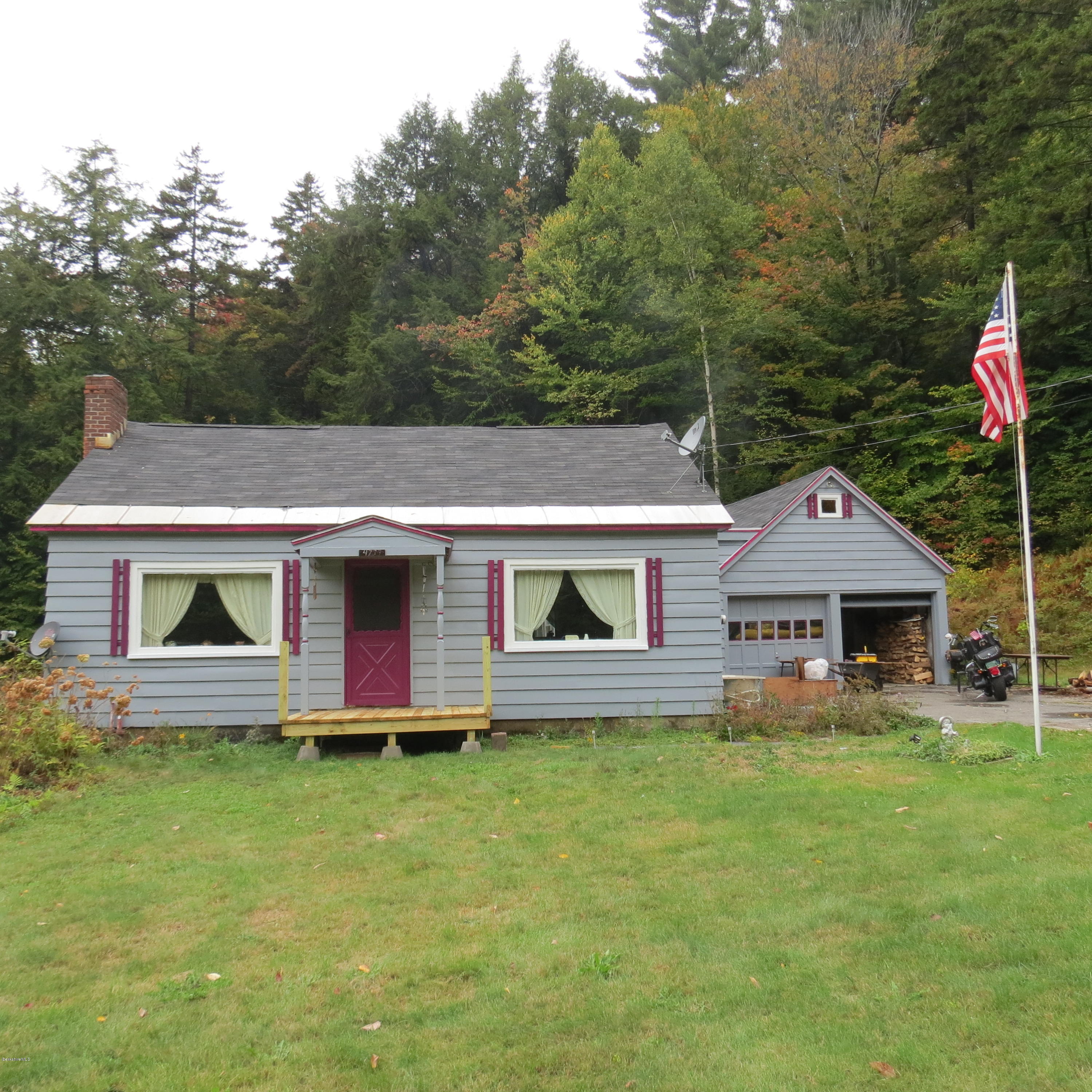 4733 Main Road Stamford, VT 05352 - Photo 38 of 39 a front view of a house with garden