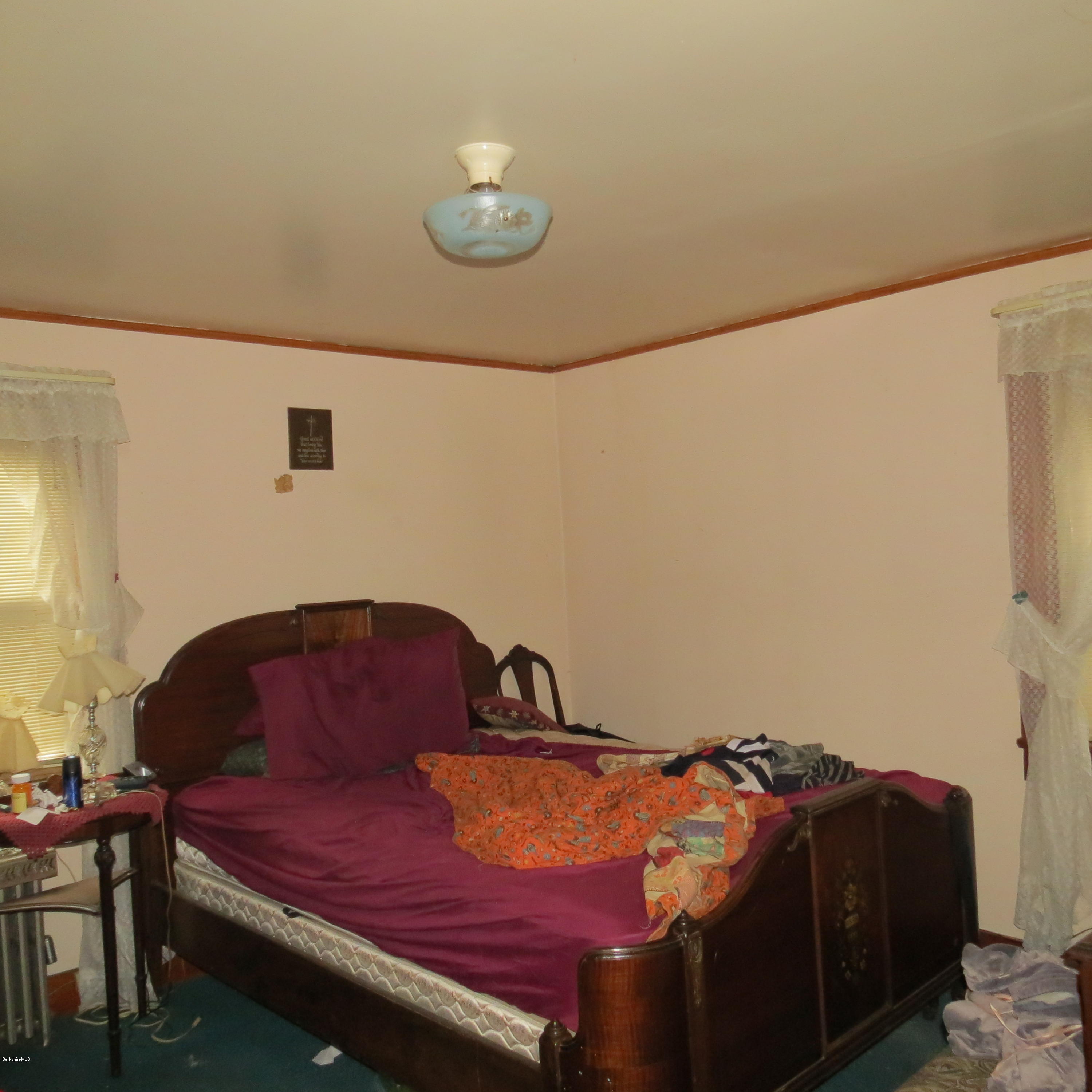 4733 Main Road Stamford, VT 05352 - Photo 5 of 39 a bedroom with a bed and a chair