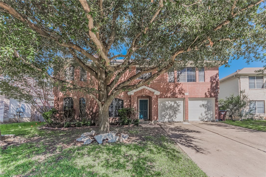 1516 Lorson Loop Round Rock, TX 78665 - Photo 1 of 1 front view of a house with a tree next to a yard