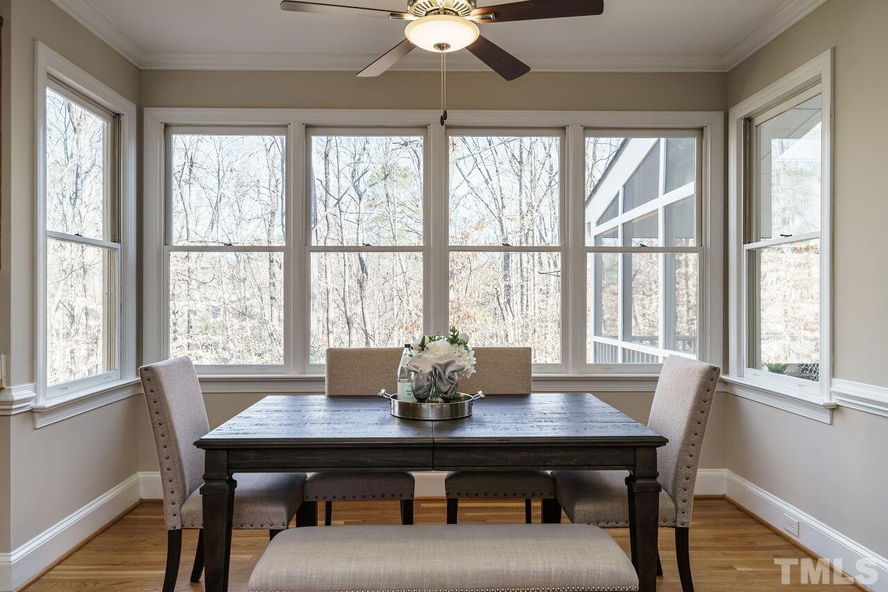 7920 Sutcliffe Drive Raleigh, NC 27613 - Photo 11 of 37 Wall of windows overlooking wooded lot