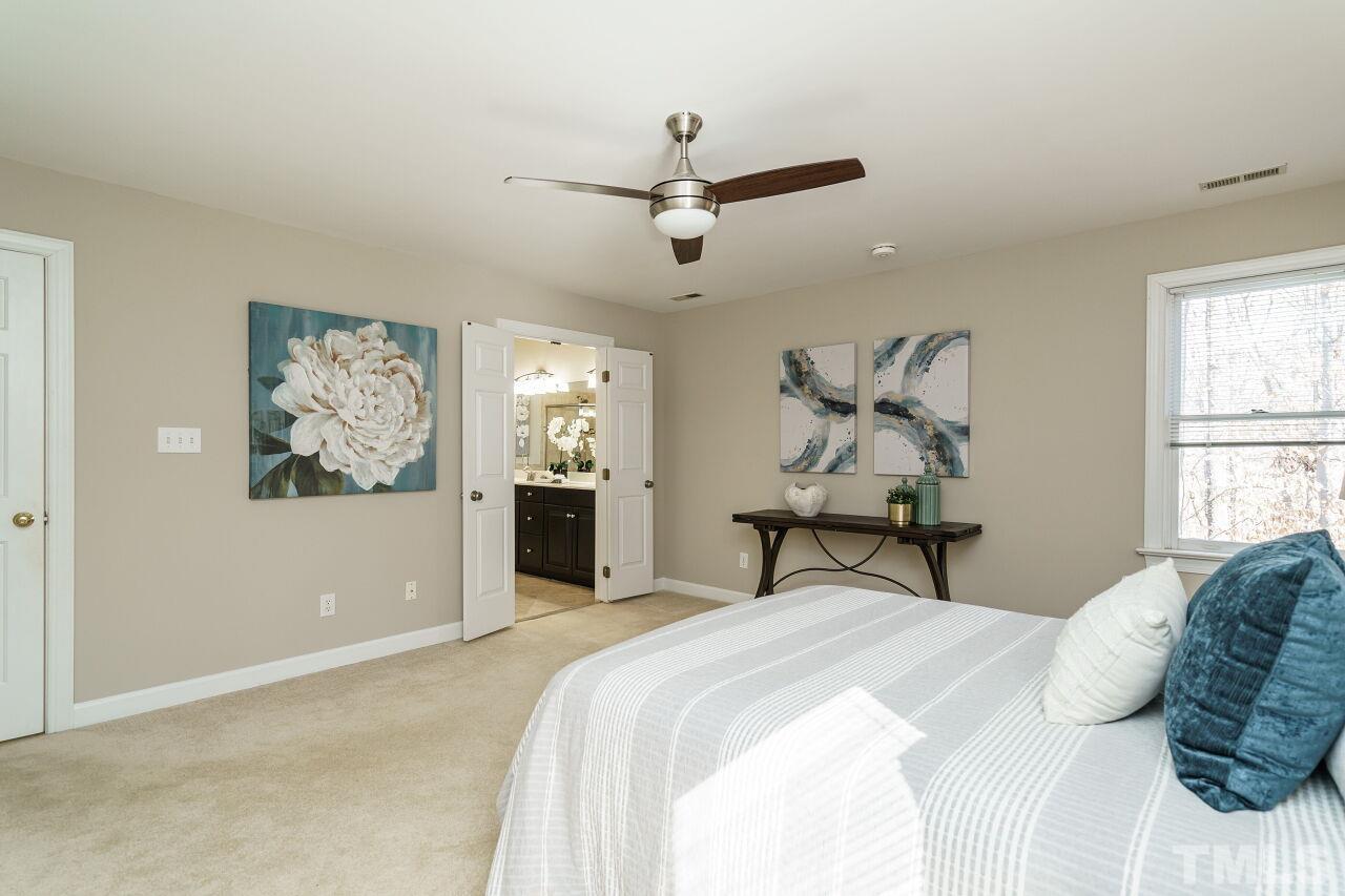 7920 Sutcliffe Drive Raleigh, NC 27613 - Photo 19 of 37 Ceiling fan with light and access to bathroom