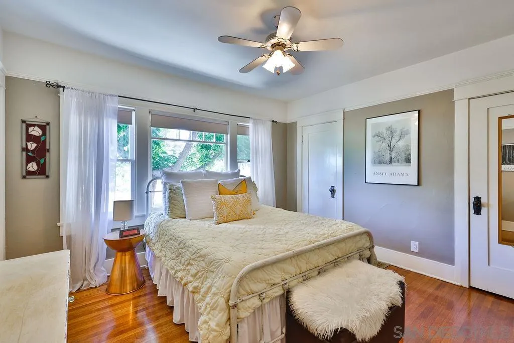 1305 Ashley Road Ramona, CA 92065 - Photo 18 of 72 a bedroom with a bed and a chandelier