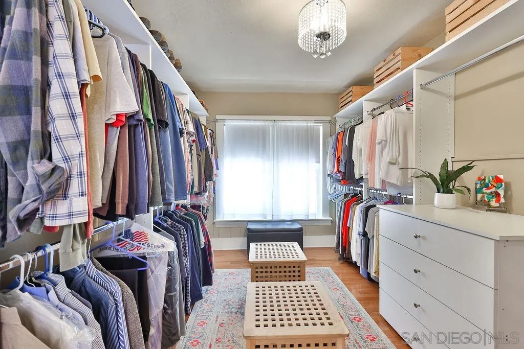 1305 Ashley Road Ramona, CA 92065 - Photo 32 of 72 a view of walk in closet with clothes and shoes