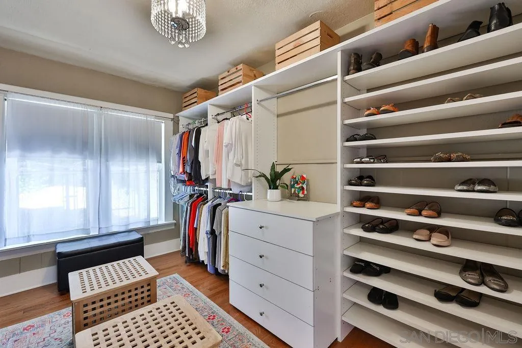 1305 Ashley Road Ramona, CA 92065 - Photo 33 of 72 a view of walk in closet with clothes and shoes