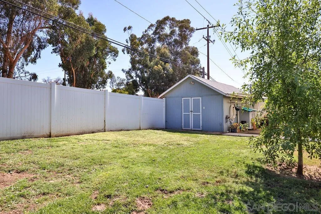 1305 Ashley Road Ramona, CA 92065 - Photo 45 of 72 a house with yard and a wooden fence