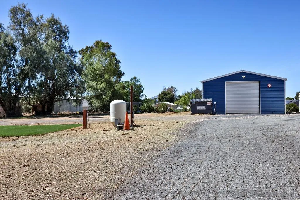 1305 Ashley Road Ramona, CA 92065 - Photo 53 of 72 a view of a house with backyard and trees