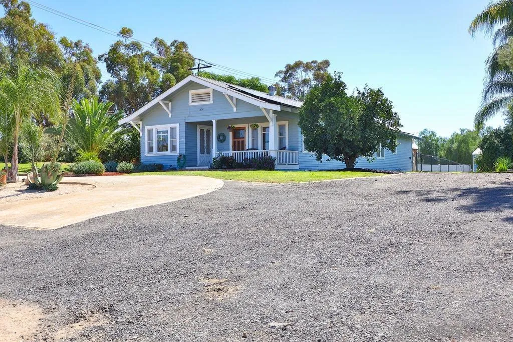 1305 Ashley Road Ramona, CA 92065 - Photo 66 of 72 a front view of a house with a yard and trees