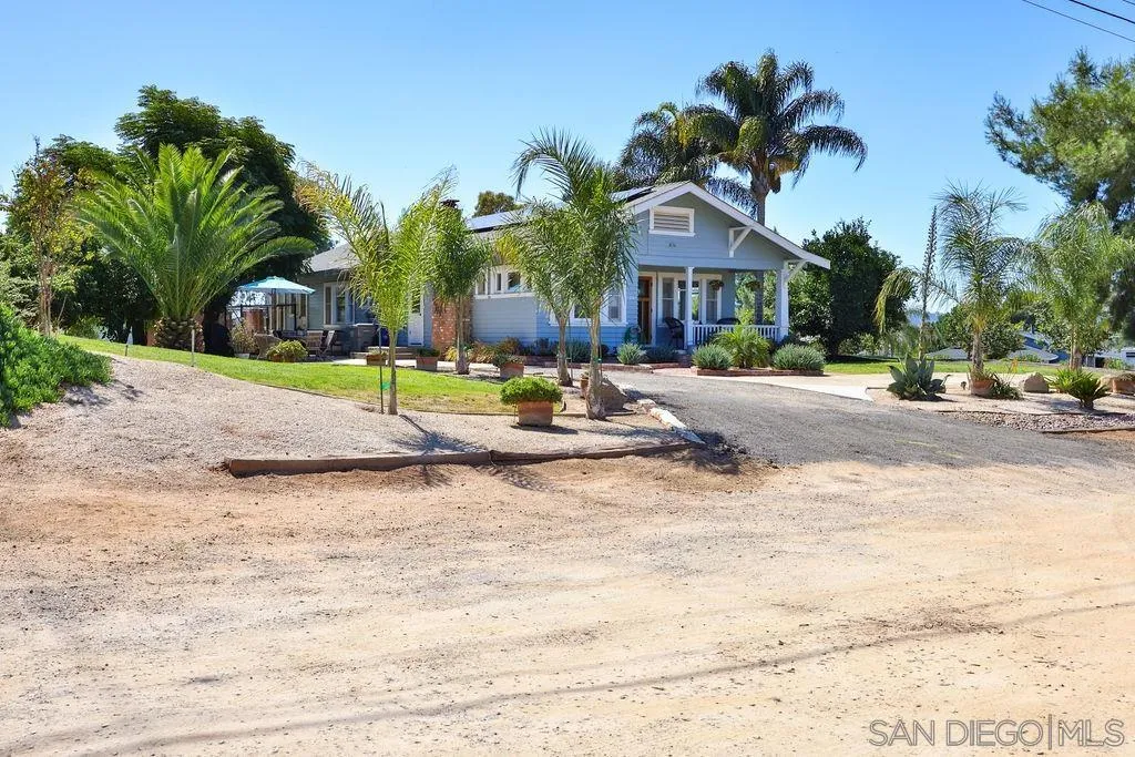 1305 Ashley Road Ramona, CA 92065 - Photo 68 of 72 a view of a house with a backyard and a garage