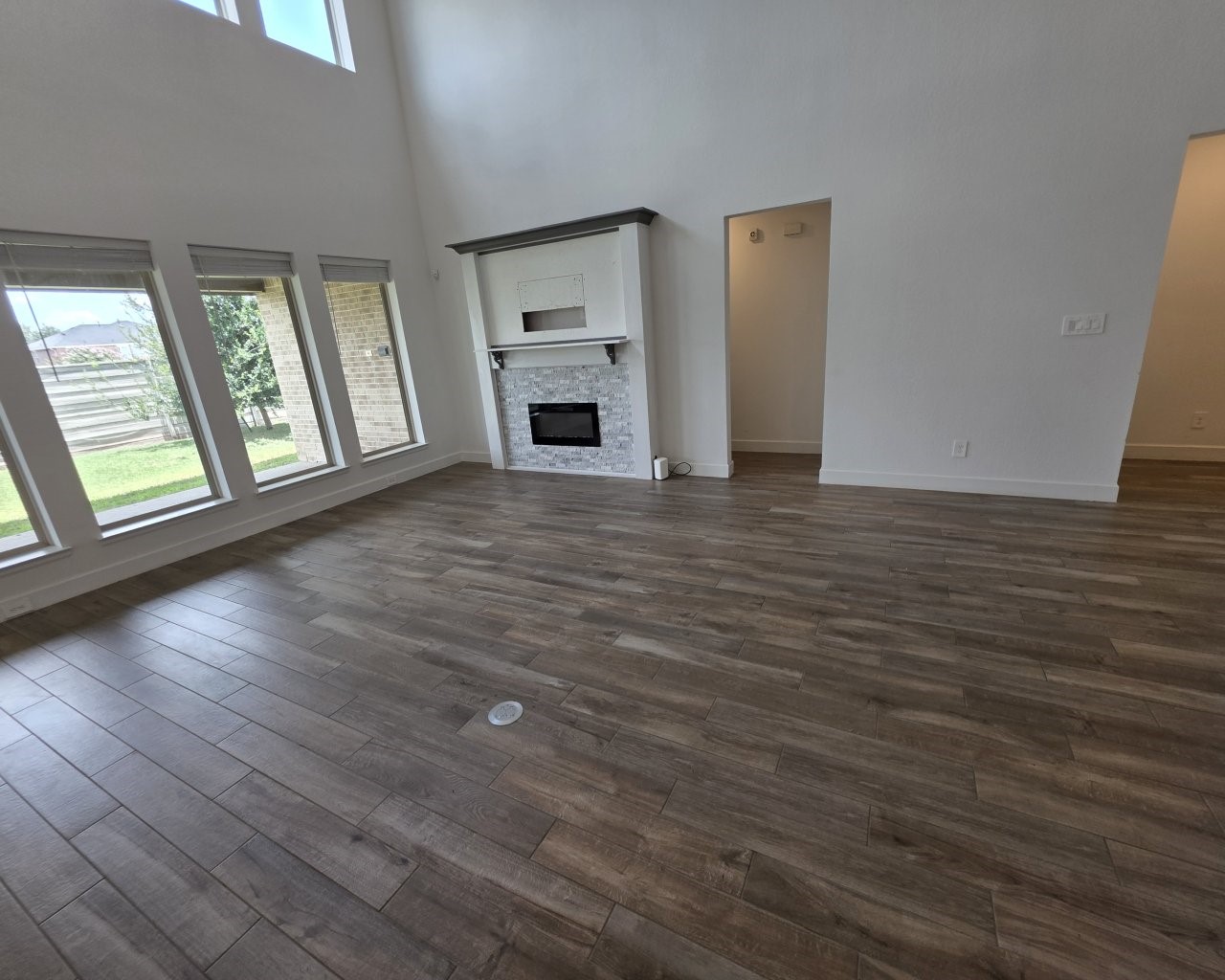 3015 Harbor Spring Way Manvel, TX 77578 - Photo 2 of 33 Spacious living area with high ceilings and fireplace.