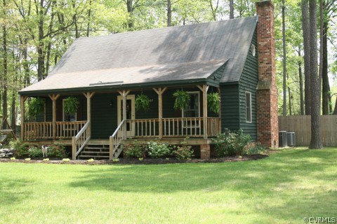 10907 Drayton Road Chester, VA 23831 - Photo 1 of 12 a view of a chair and table in backyard of the house
