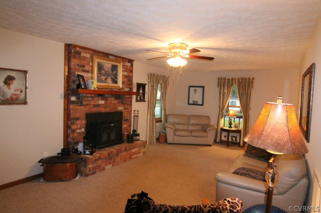 10907 Drayton Road Chester, VA 23831 - Photo 3 of 12 a view of a livingroom with furniture and a fireplace