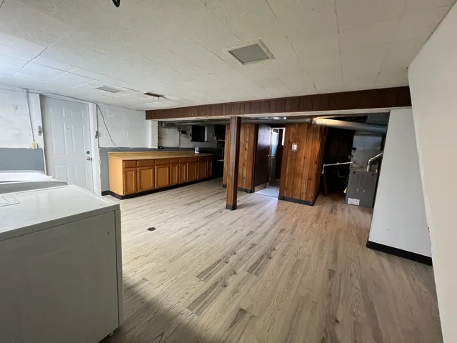 a living room with furniture and a walk in closet