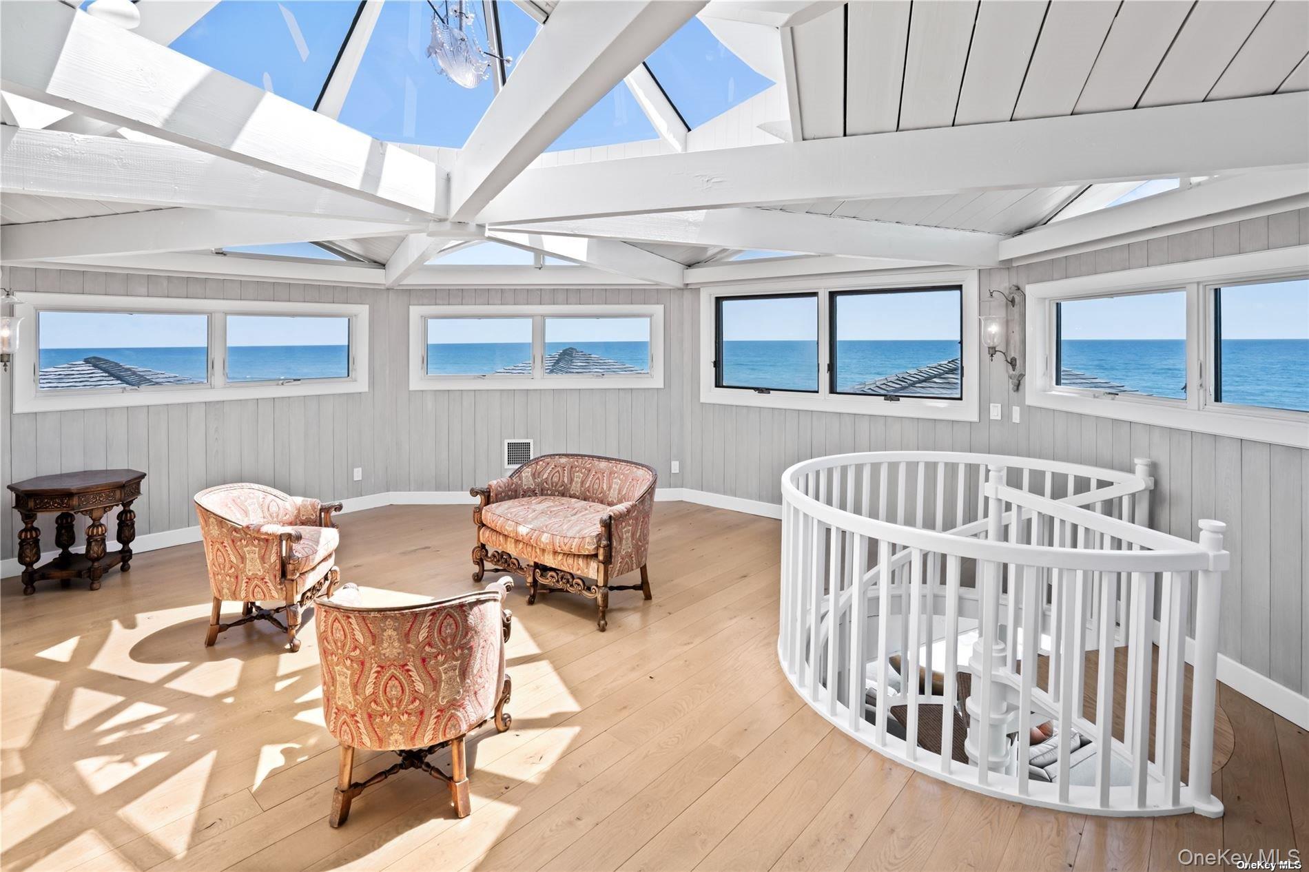 174 Dune Road Quogue, NY 11959 - Photo 11 of 35 a view of a dining room with furniture window and outside view