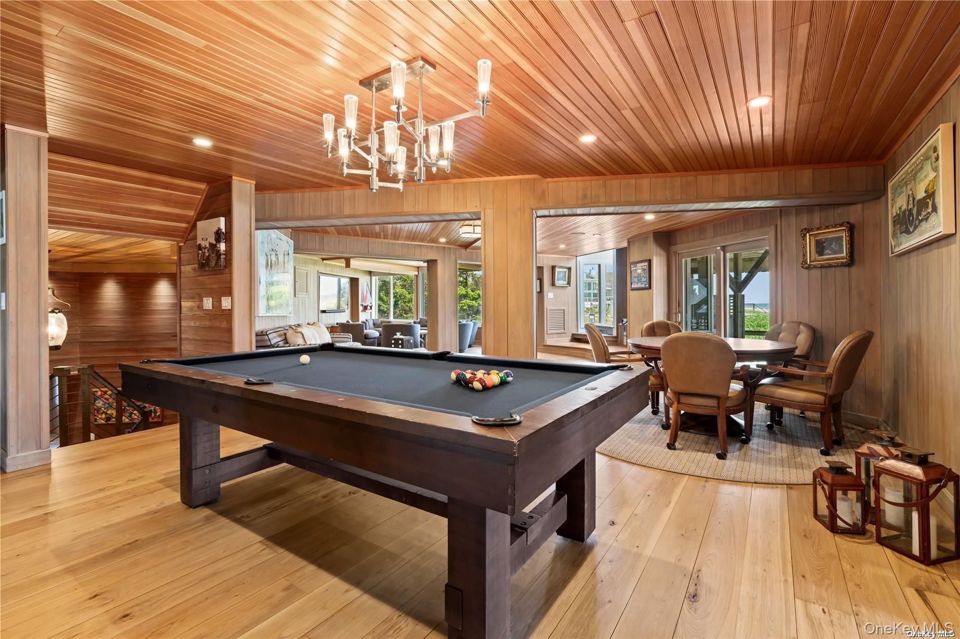 174 Dune Road Quogue, NY 11959 - Photo 19 of 35 a room with furniture pool table and windows