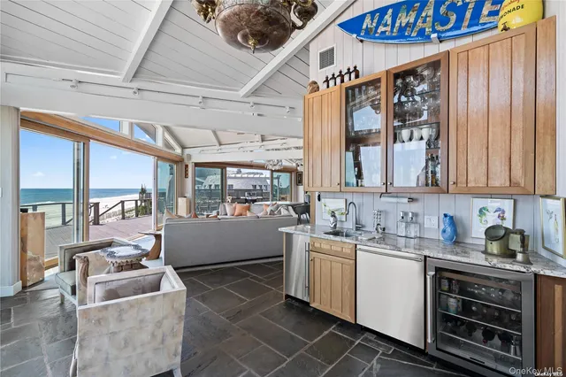 a kitchen with sink a stove and cabinets