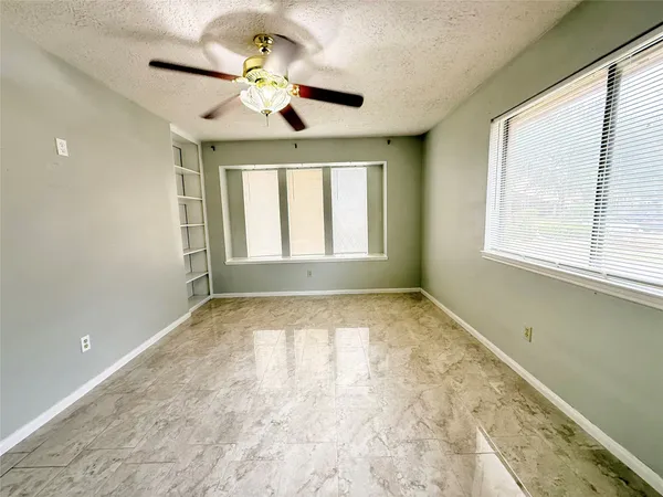 a view of an empty room and window