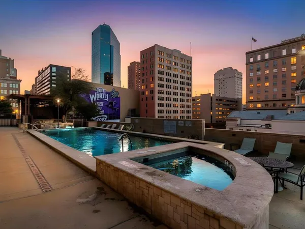 a view of swimming pool from a balcony