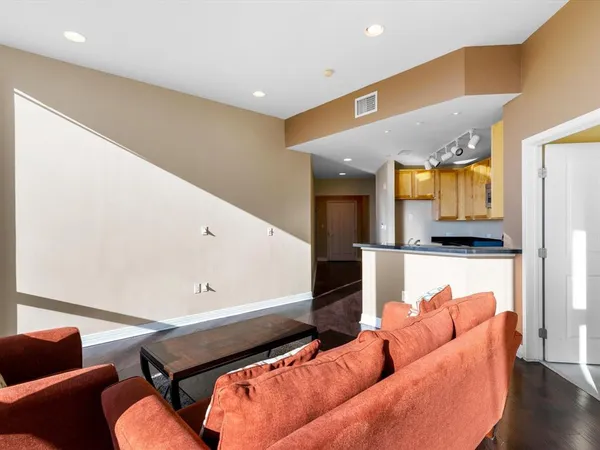 a living room with furniture and a rug