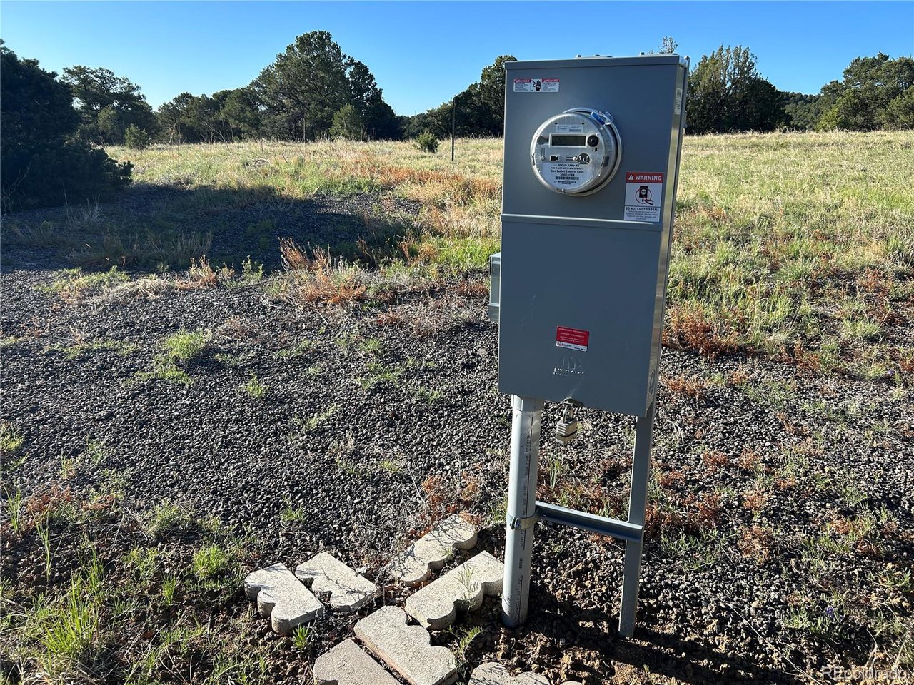 165 Silver Spur Road Walsenburg, CO 81089 - Photo 2 of 18 a sign that is on a brick wall