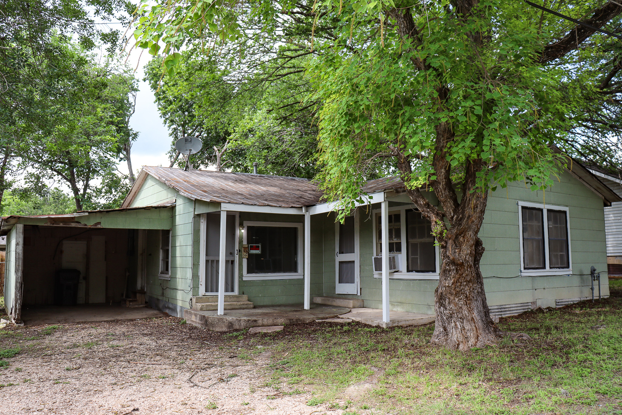 803 3rd Street Lockhart, TX 78644 - Photo 14 of 15 a front view of a house with garden