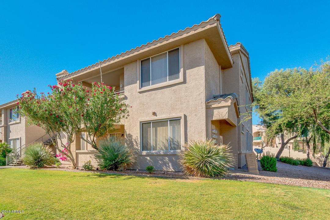 16013 South Desert Foothills Parkway, Unit 2090 Phoenix, AZ 85048 - Photo 1 of 43 a view of a house with a yard