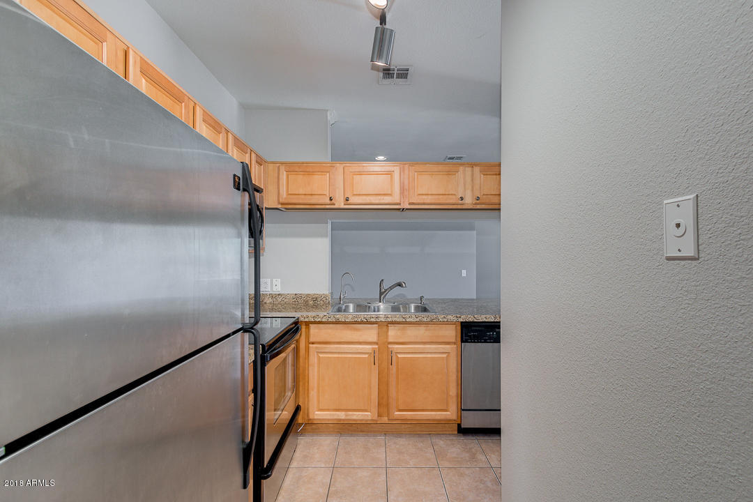16013 South Desert Foothills Parkway, Unit 2090 Phoenix, AZ 85048 - Photo 16 of 43 a bathroom with a sink and a mirror
