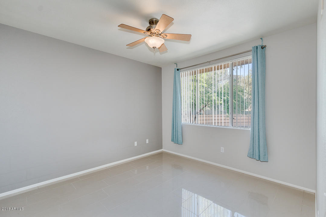 16013 South Desert Foothills Parkway, Unit 2090 Phoenix, AZ 85048 - Photo 18 of 43 an empty room with a window