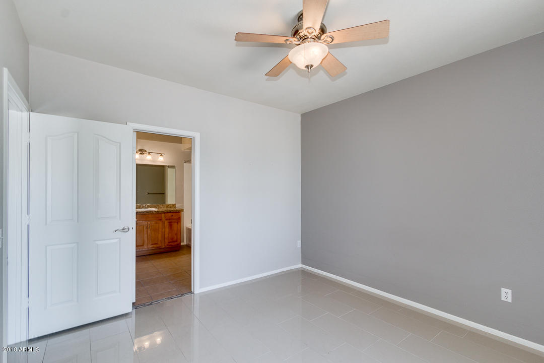 16013 South Desert Foothills Parkway, Unit 2090 Phoenix, AZ 85048 - Photo 21 of 43 an empty room and a view of bathroom
