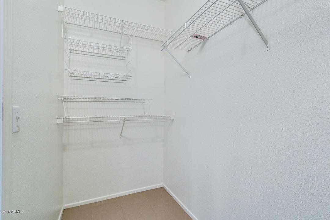 16013 South Desert Foothills Parkway, Unit 2090 Phoenix, AZ 85048 - Photo 23 of 43 a view of walk in closet with empty racks