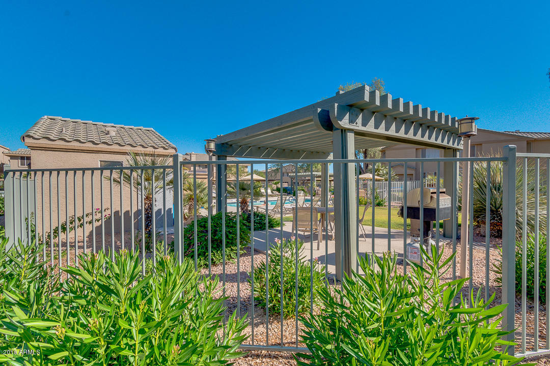 16013 South Desert Foothills Parkway, Unit 2090 Phoenix, AZ 85048 - Photo 35 of 43 a front view of a house with a garden