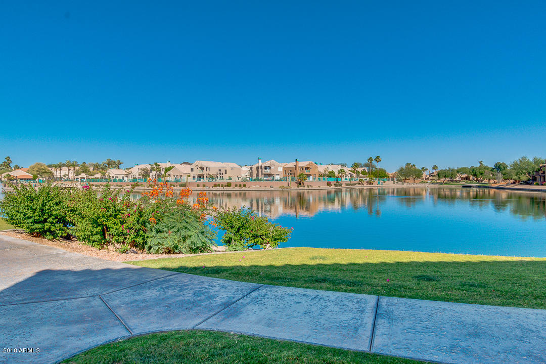 16013 South Desert Foothills Parkway, Unit 2090 Phoenix, AZ 85048 - Photo 37 of 43 a view of a lake with houses in the back
