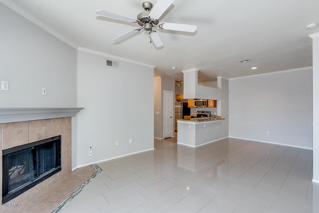 16013 South Desert Foothills Parkway, Unit 2090 Phoenix, AZ 85048 - Photo 7 of 43 a view of kitchen with cabinets and fireplace