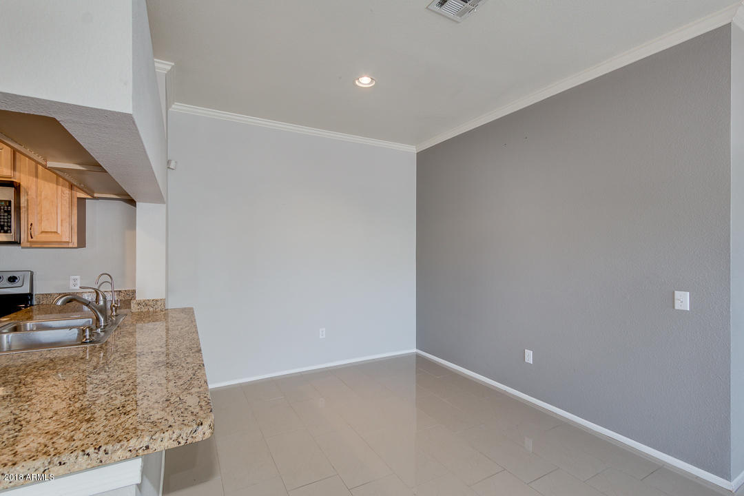 16013 South Desert Foothills Parkway, Unit 2090 Phoenix, AZ 85048 - Photo 10 of 43 a bathroom with a granite countertop sink and vanity