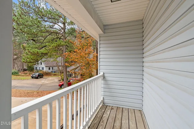 a view of a balcony with wooden floor
