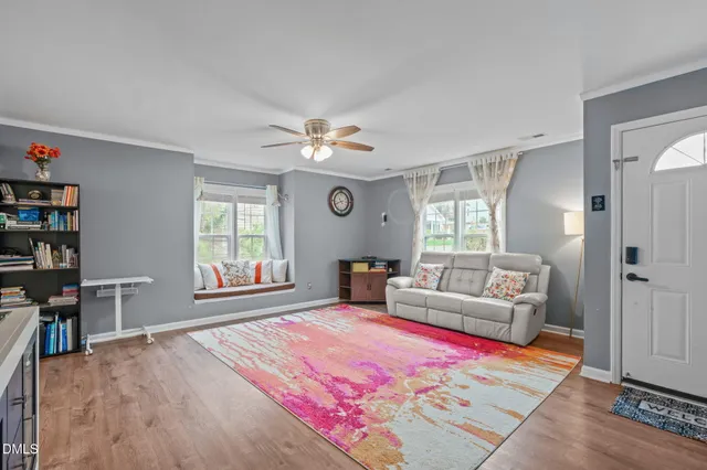 a spacious bedroom with a bed and a chandelier