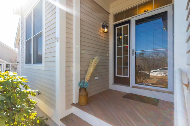 a view of front door of house with stairs