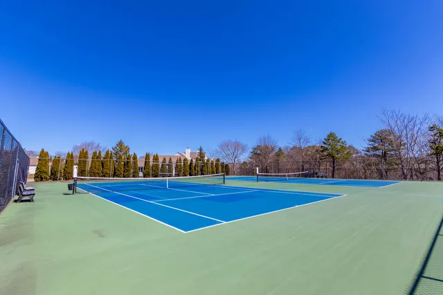 a view of an outdoor space and tennis court